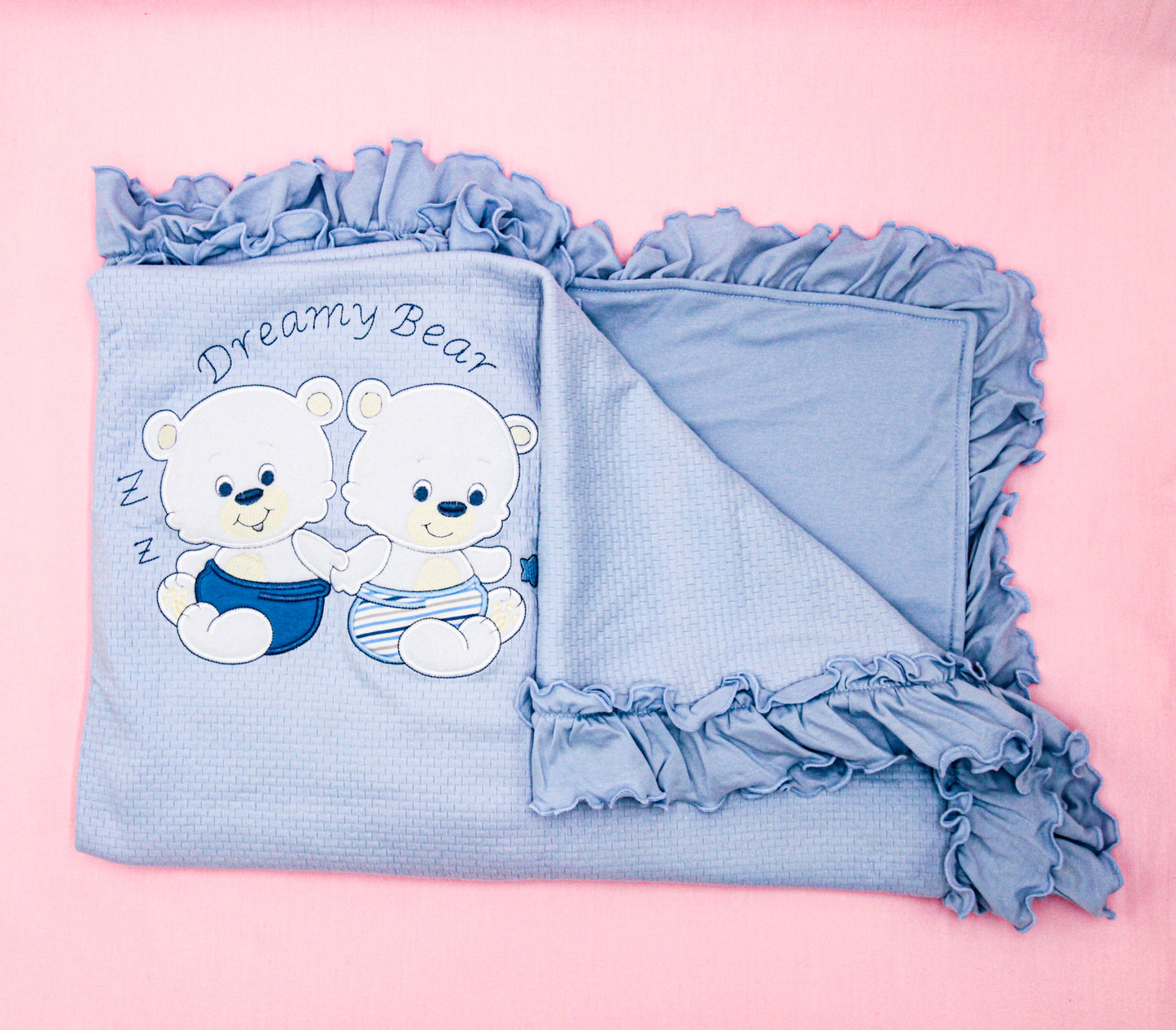 MANTA JACQUARD C/ BOBOS EN COLOR CELESTE