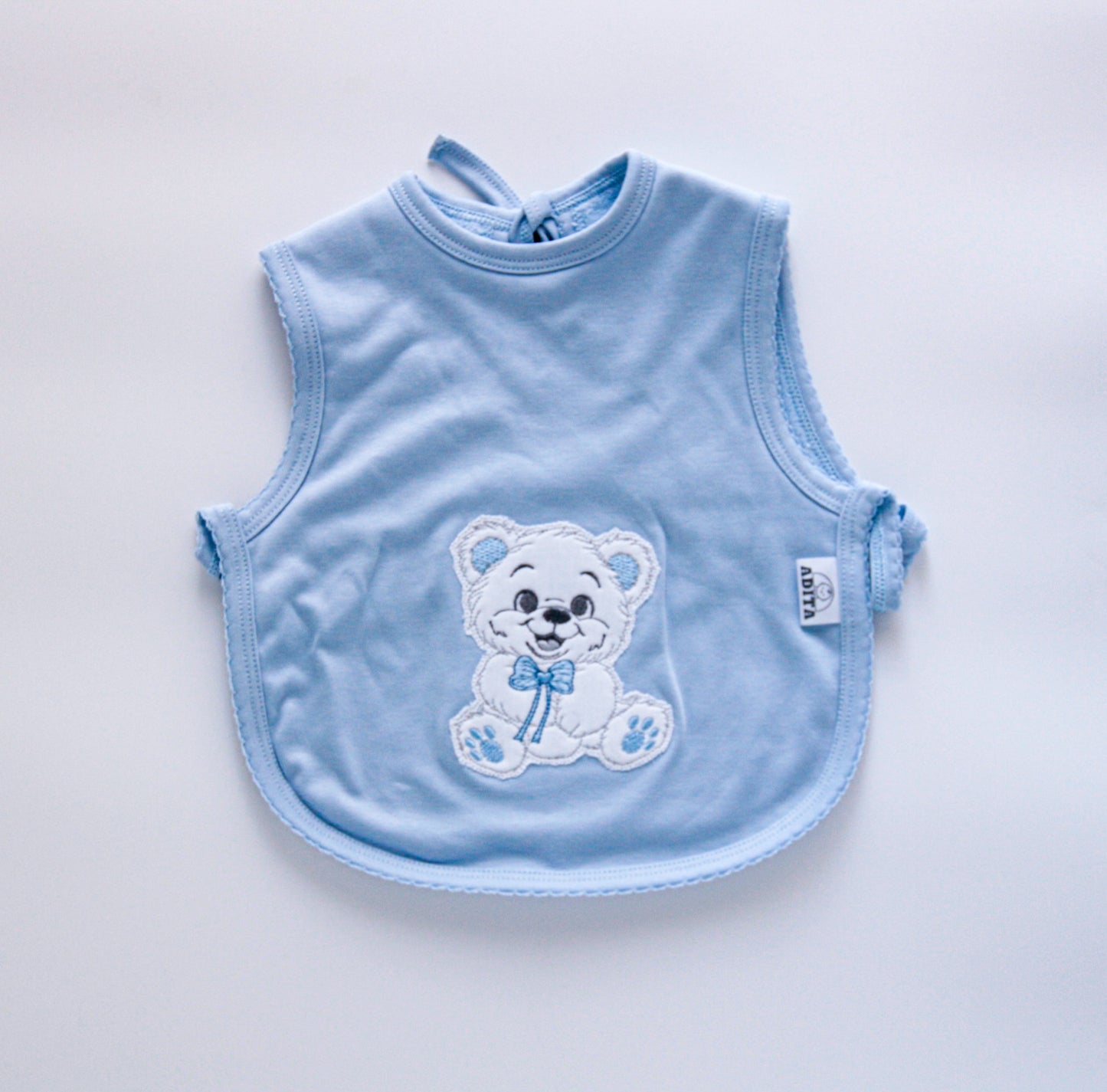 BABERO MANDIL EN COLOR CELESTE